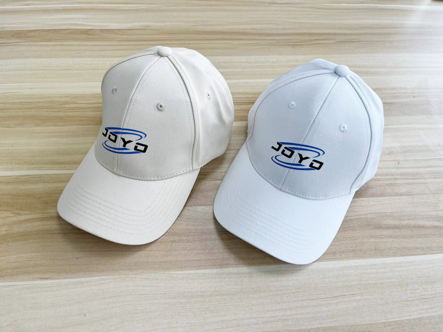 Two baseball caps with JOYO logo